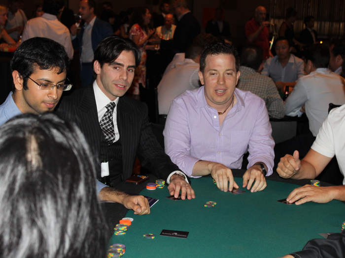 Professional poker player Olivier Busquet and John Netto, president of M3 Capital. There was a bounty on the three pro poker players in attendance given to the player who knocked them out of the tournament.