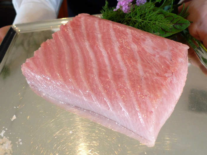 Next was the grilled pavé of Japanese Toro. Before it was cooked, the waiter showed the group the tuna they would be eating.