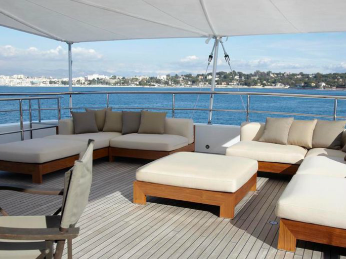 If the sun gets too strong, there are lounge chairs under a retractable awning, at the rear of the yacht.