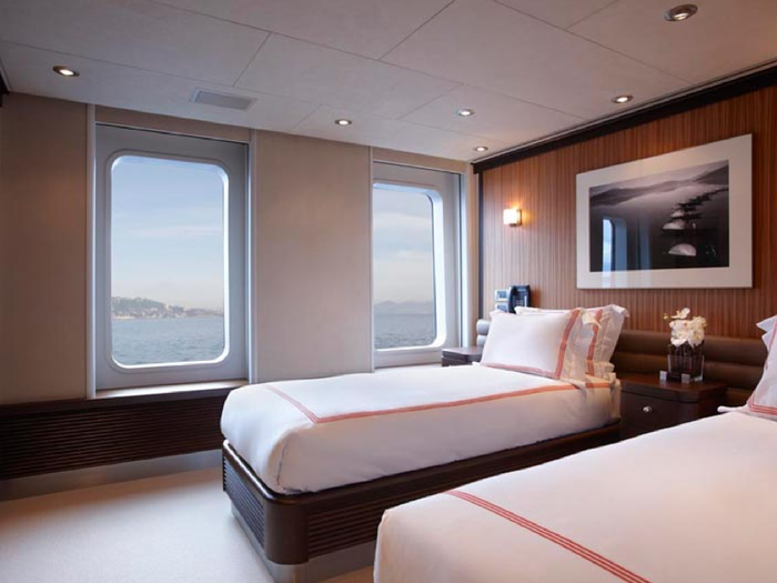 No portholes here: This stateroom, with twin single beds, has two large windows.