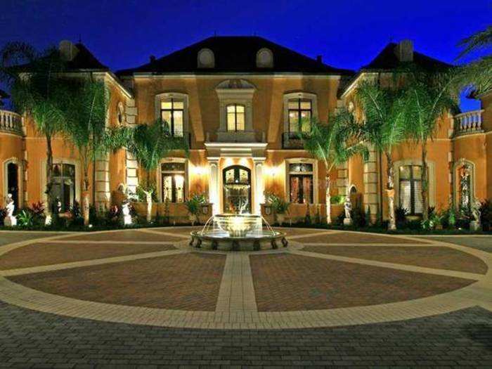 A dramatic double marble staircase welcomes you into this Windermere, Fla. chateau.