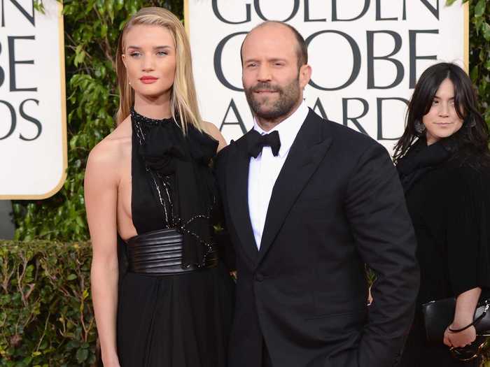 Rosie Huntington-Whiteley may not be able to beat her movie hard man beau, Jason Statham, in an arm wrestle, but she can at least beat him on a height chart.