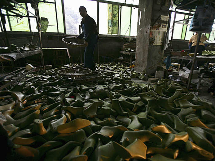 China makes more than seven times as many pair of shoes per person as the rest of the world.