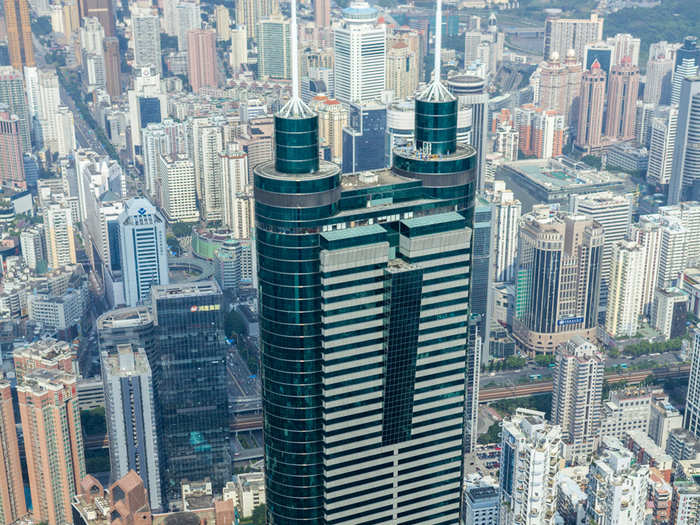 The Kingkey 100 (aka KK 100), in Shenzen, China, reaches 1,449 ft. and contains 100 floors for office space and a hotel. Here you