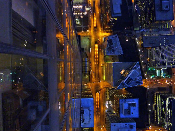 The Willis Tower (aka the Sears Tower) is a 108-story, 1,451-foot skyscraper in downtown Chicago. Part of the observation deck has a glass floor, where you can look straight down to the street.