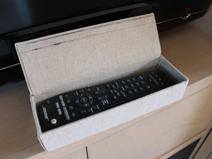 The remote is kept in this little box.