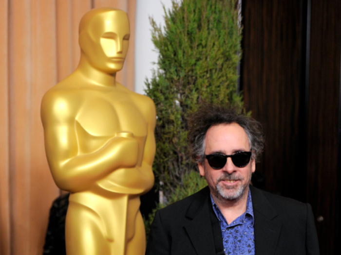 Tim Burton showed off his latest accessory: a sling.