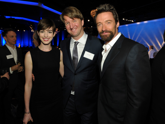 Anne Hathaway stuck close to her "Les Misérables" director Tom Hooper and co-star Hugh Jackman.