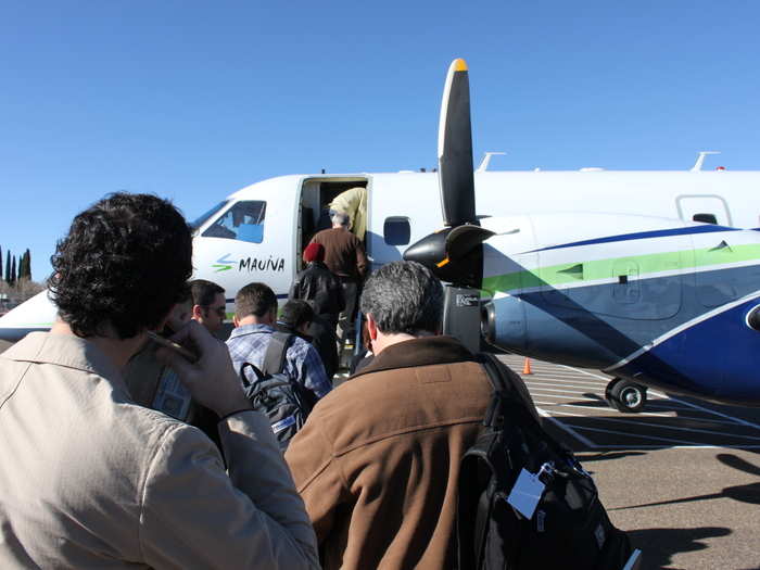 Everyone soon boarded the Embraer EMB 120 Brasilia, a twin turbo-prop plane.