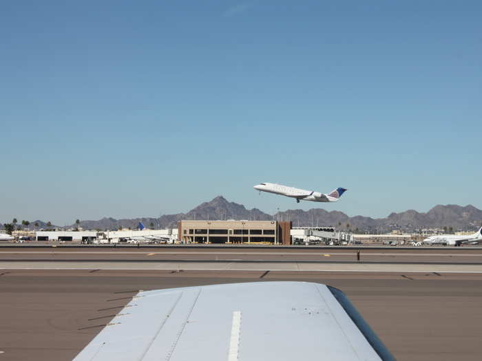 Waiting on the runway, we watched a United flight take off.