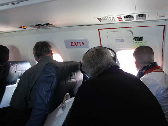 With the noise of the propellers and the scenery below, there was little conversation between passengers. This is how most people spent the flight.