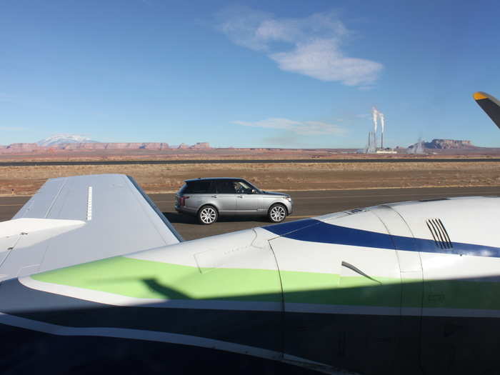 As soon as the plane stopped, a fleet of new Range Rovers rolled up.