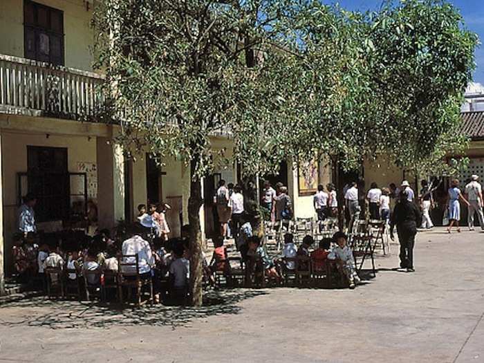 Tour members wandered around the school courtyard, snapping photos. I do not remember any of the teachers or children speaking English. Nor do I remember any tour members speaking Chinese. I might have tried 