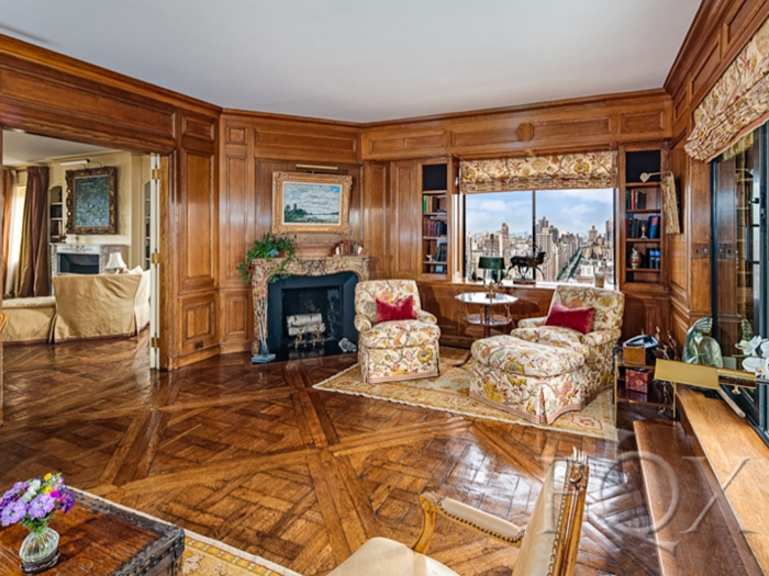 The library has its own East-facing terrace, another fireplace, and more of those gorgeous parquet floors.