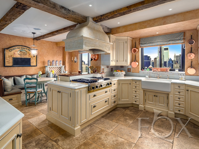 The French country kitchen was recently renovated with top-of-the-line appliance.