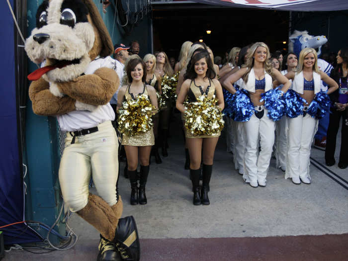 The cheerleaders for the Saints and Colts prepare to take the field