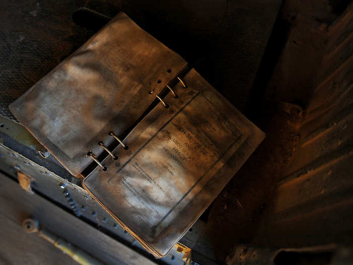 An old, weathered flight manual sits inside the remains of a CH-3E Jolly Green Giant. After years of standing in the desert sun of the boneyard, aircraft and equipment slowly age and erode.