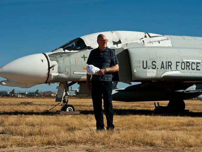 Retired Brig. Gen. Keith Connolly, a command pilot with more than 4,800 flying hours in F-86s, F-100s, A-7s, F-4s, F-15s and F-16s, stands before a retired F-4 Phantom.