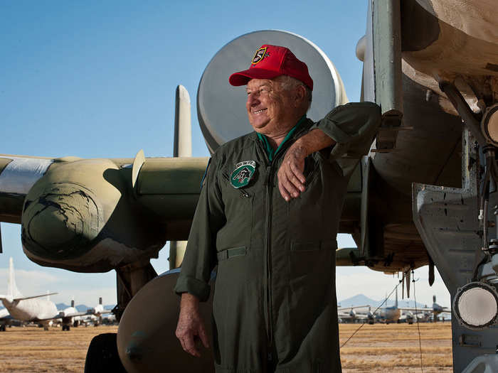 Ret. Col. Paul Dillon, a vietnam combat pilot, stands with an A-10 Thunderbolt II. The jet is one of the many airframes the colonel flew while in the Air Force. Dillon is wearing his 469th Tactical Fighter Squadron flightsuit from his duty in Vietnam were he flew interdiction operations in North Vietnam and Laos.