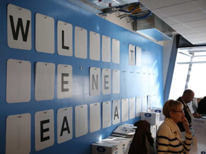 This Wheel of Fortune wall is one way teams express themselves.