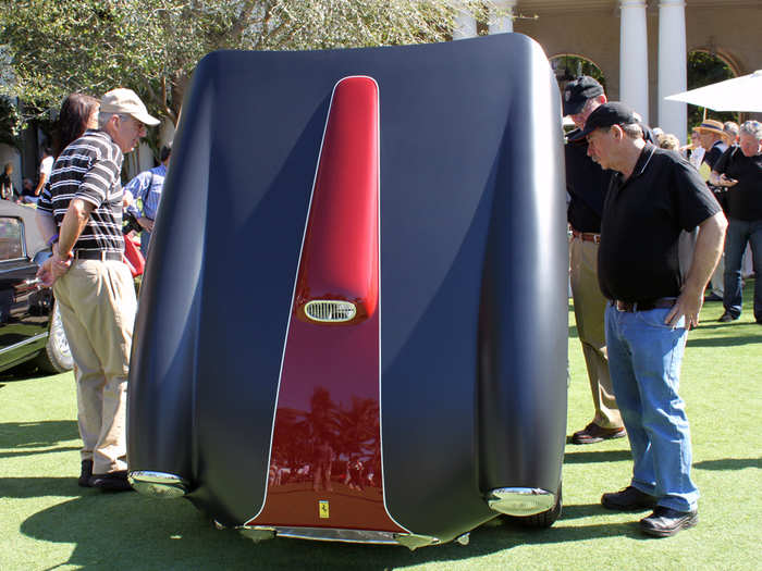 A crowd gathered around a rare 166 MM with a matte finish.