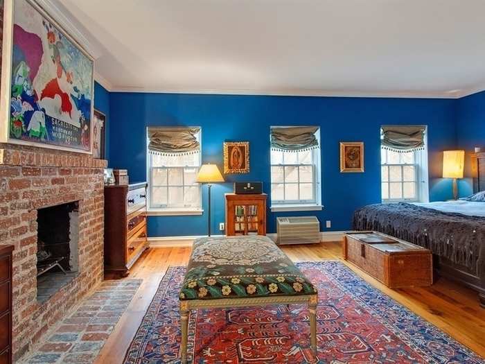 The master suite takes up the fourth floor of the townhouse with its bright blue walls.