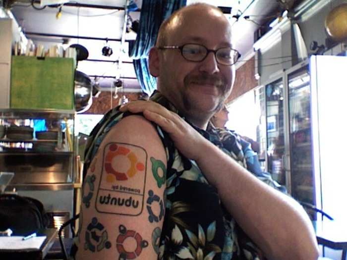 This diehard open source fan is tatted up with Linux logos.