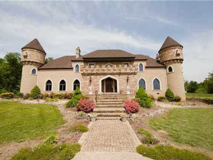 Park all four of your cars in the garage of this castle home.