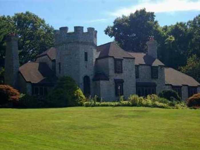 This English manor-style castle has a waterfall and fish pond.