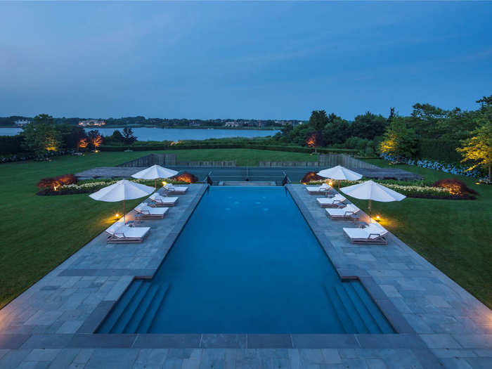 The infinity edge pool extends towards the bay.