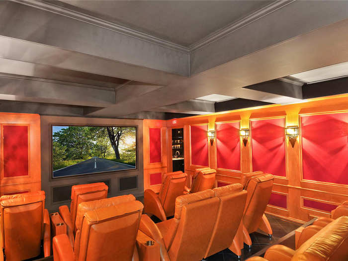 Check out the deluxe movie theater with multiple rows of plush lounge chairs.