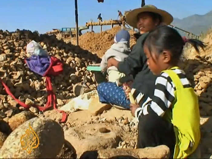 Children as young as four and the elderly often work on government-controlled mines for about $1.50 a day.