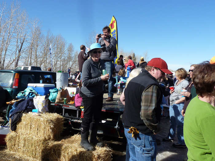 While a very colorful cast of spectators cheers the racers on from flatbed trucks and hay stacks on the sidelines.