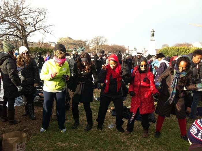 Obama supporters dance the Cupid Shuffle to stay warm while they wait for the ceremony to begin.