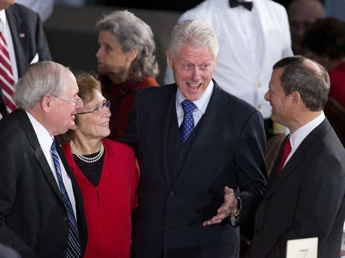 Clinton works the room at the Inaugural Luncheon following the ceremony. Here he is with Sen. Carl Levin (D-Mich.) and Chief Justice John Roberts.