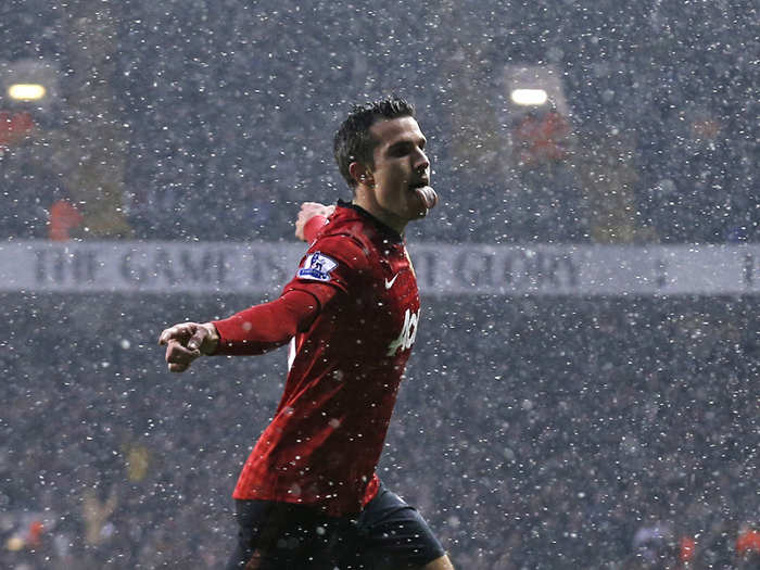 Robin van Persie licking the snow to celebrate a goal