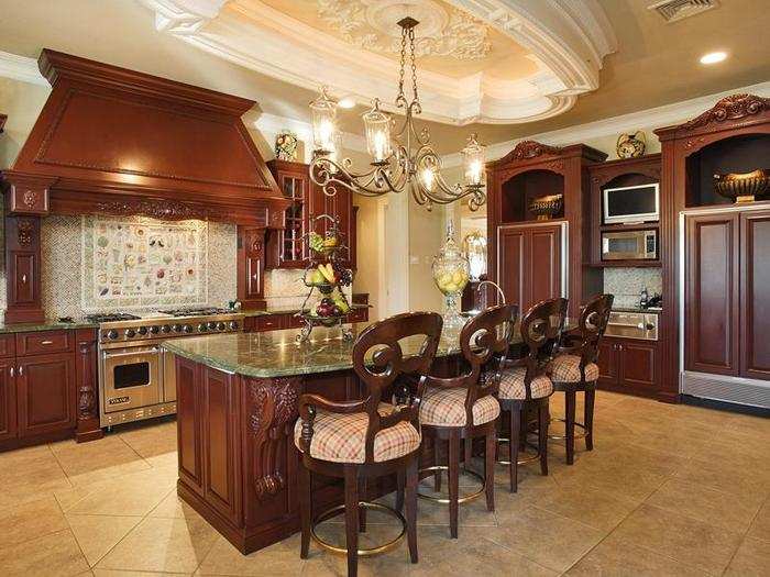 A massive kitchen with a hidden refrigerator.