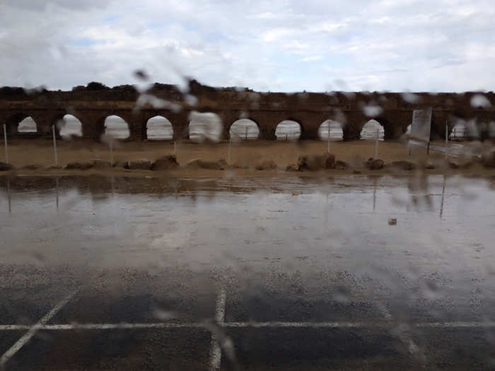 Waves crash along the ruins of a Roman aqueduct in Caesarea, an ancient Mediterranean town where Jesus