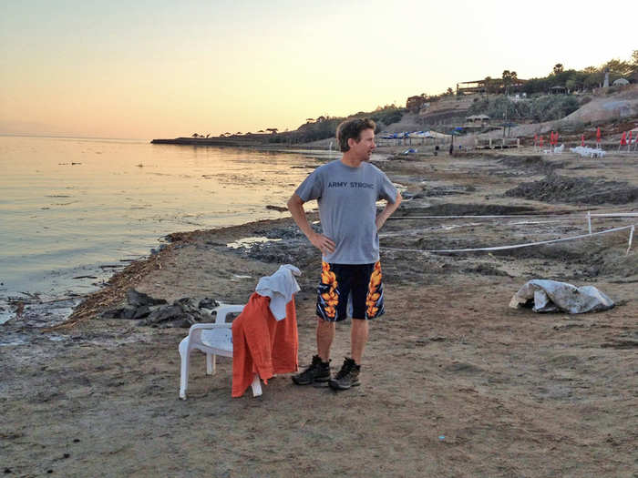 Paul waits for his wife Kelley to take a float in the Dead Sea.