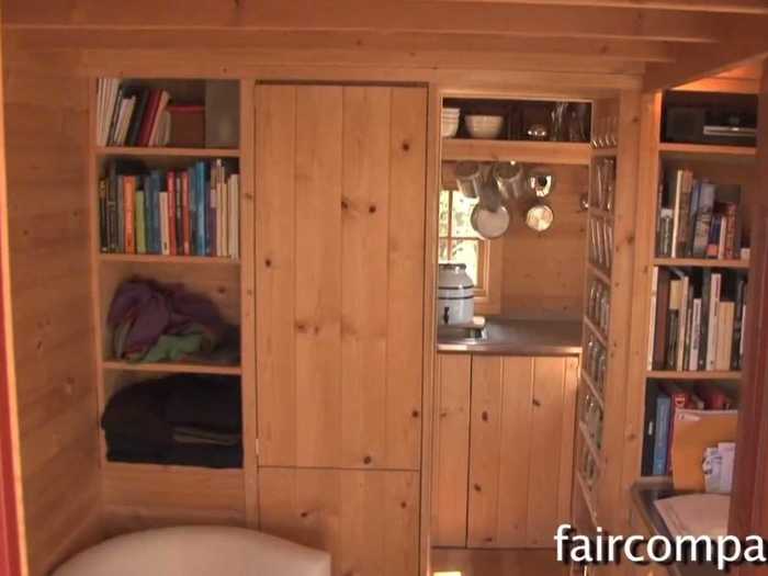 This 89-square-foot home has an "entertainment area," a kitchen, and even a fireplace.