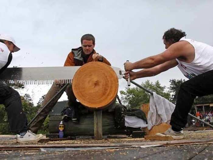 Husband and wife duo Dale and Amanda Beams of Winkleigh, Australia compete in the "double buck" event, also known as the Jack and Jill.