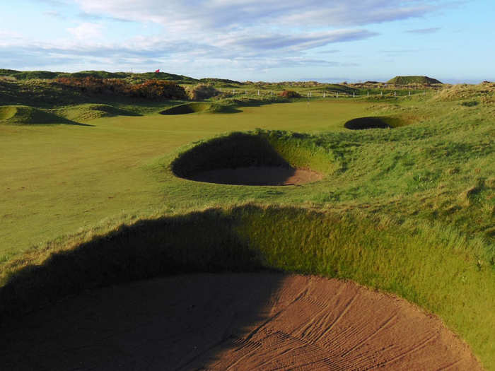 Instead of ocean views or high dunes, Carnoustie in Scotland wows its players with one of the toughest course layouts in the world. The 15th, 16th, and 17th holes are some of the best holes in golf, though its hard to find a weak hole on the course.