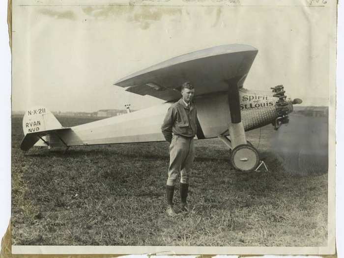 1927 - A young Charles Lindbergh stands next to the Spirit of St. Louis, which he famously flew from Roosevelt Island all the way to Paris.