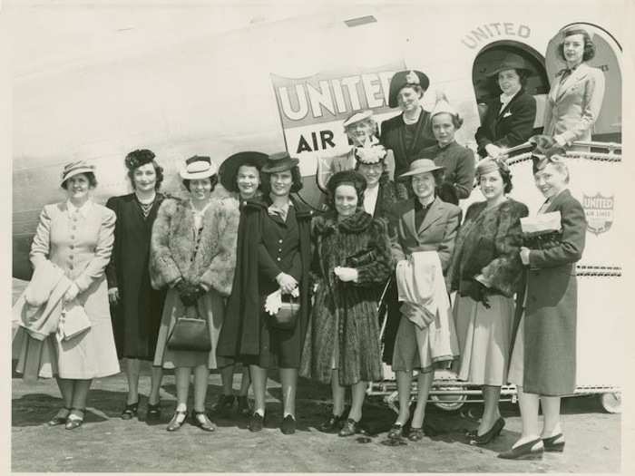 1940 - Women stand in front of a new United Airlines plane at the New York World