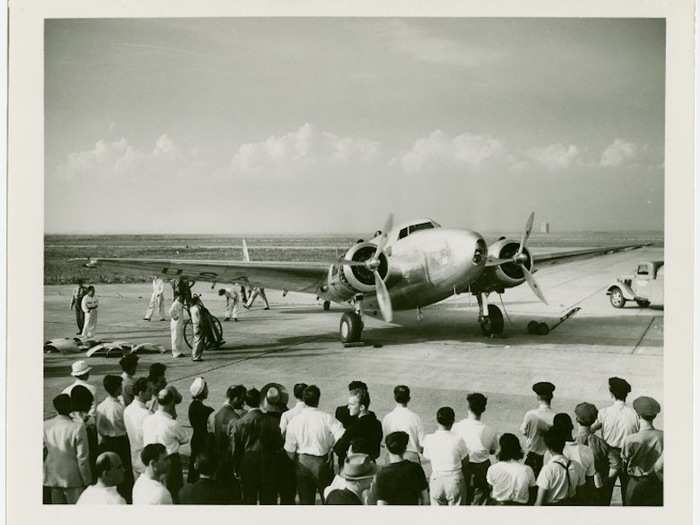 1940 - Onlookers gaze at famed aviator Howard Hughes