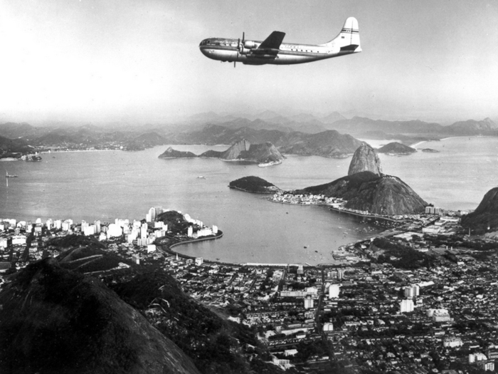 A Boeing B-377 Stratocruiser flies over Rio (date unknown).