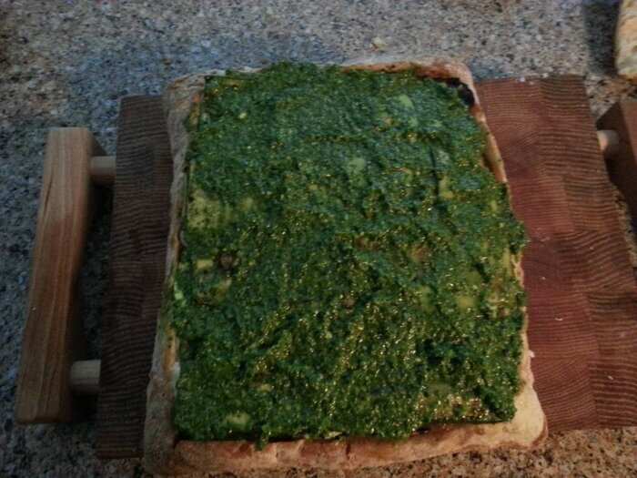 Tomatoes, pesto, fresh mozzarella, zucchini, arugula, caramelized onions. Mix. Then put the bread lid on top.