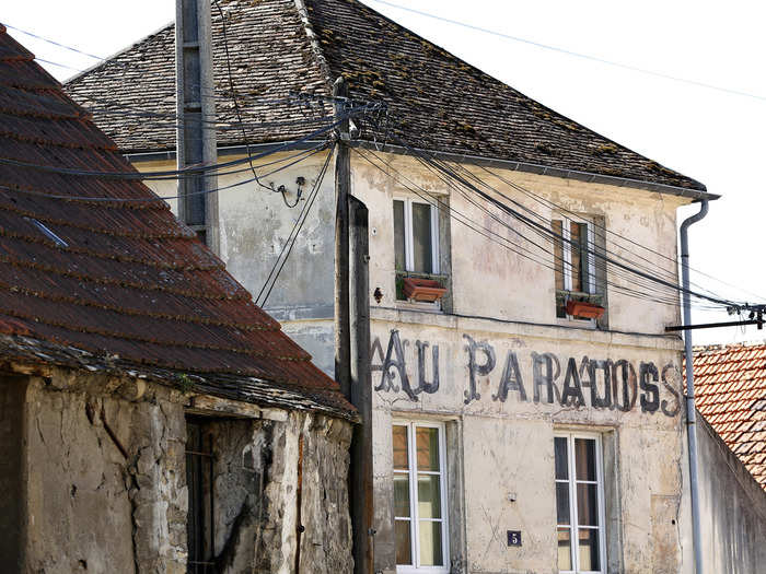 Today, the ruins of the town show what life for residents was like before the Charles de Gaulle airport. This former cafe was called "Au Paradis" (in Heaven).