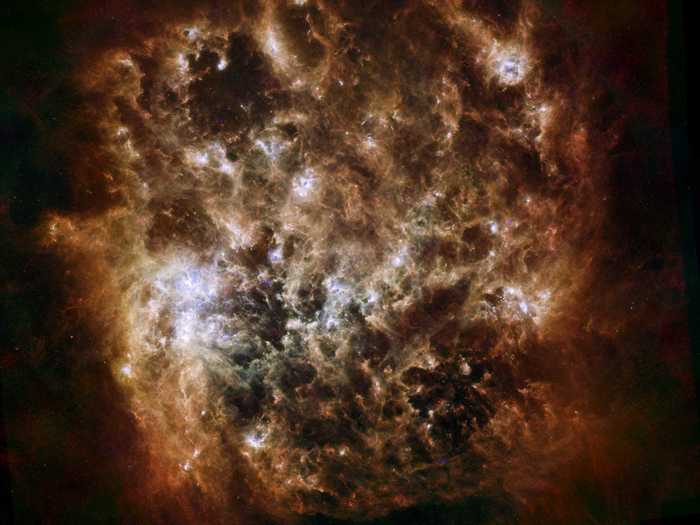 The "flames" in this Large Magellanic Cloud galaxy are actually giant ripples of dust, spanning hundreds of light years.