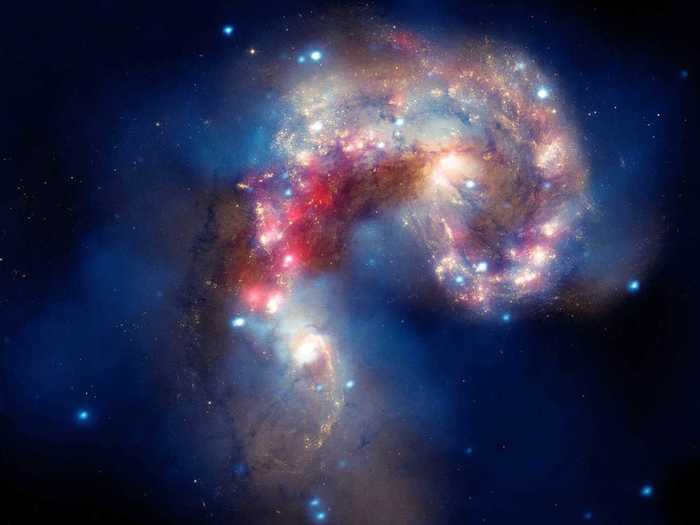 Spitzer caught these two "antennae" galaxies entangled with each other.